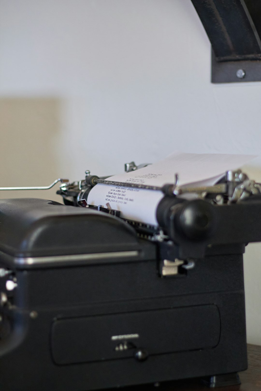 Vintage typewriter with old documents on a wooden desk